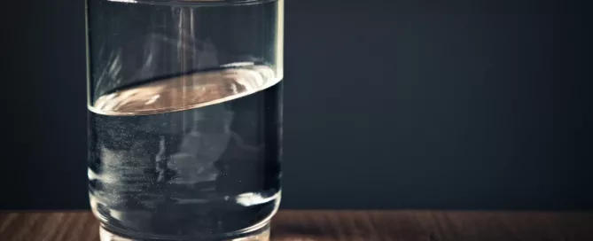 glass filled with clear drinking water