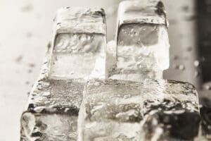 close up view of transparent wet textured ice cubes