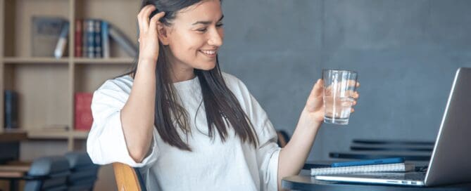 woman drinking a glass of water